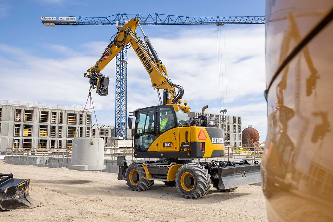 MX16G Transporting Heavy Concrete Pipe Through Construction Site